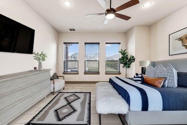 tiled bedroom with ceiling fan