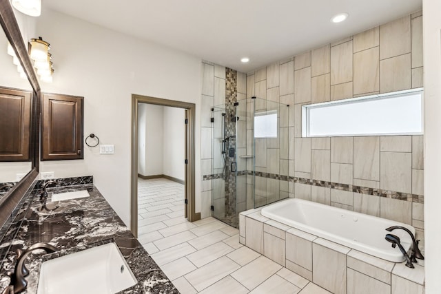 bathroom with vanity, tile patterned flooring, and plus walk in shower