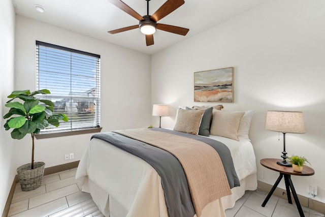 tiled bedroom with ceiling fan