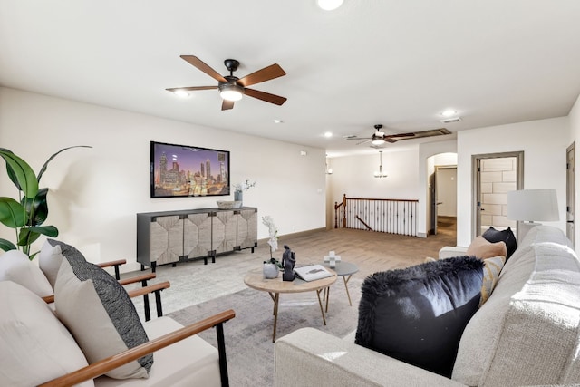 living room with light carpet and ceiling fan