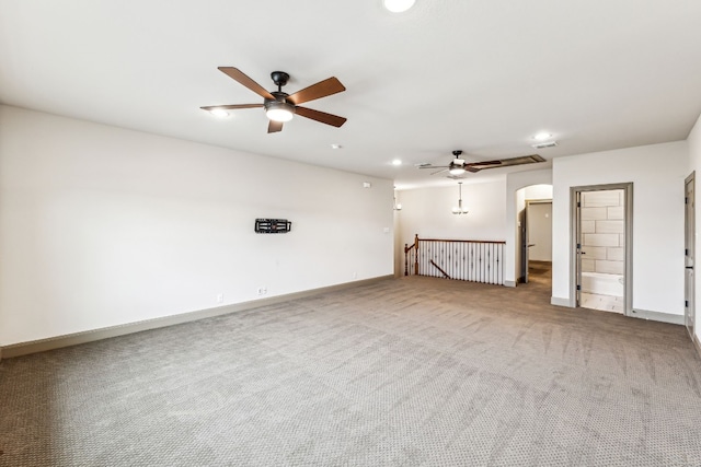 unfurnished living room featuring carpet floors and ceiling fan