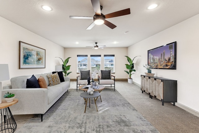 living room featuring light carpet and ceiling fan