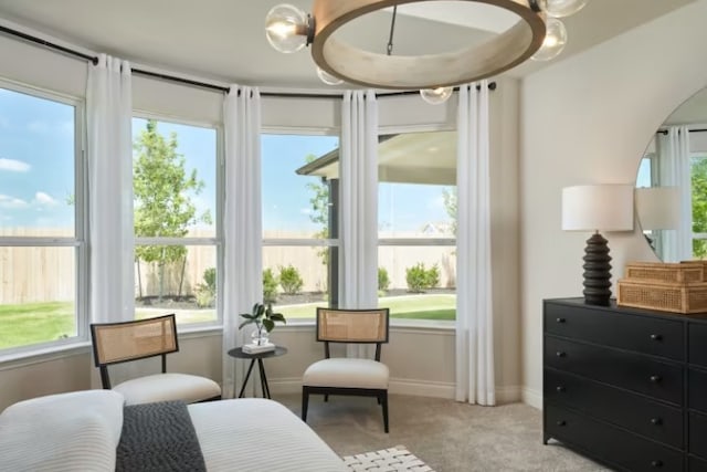 carpeted bedroom featuring multiple windows and an inviting chandelier