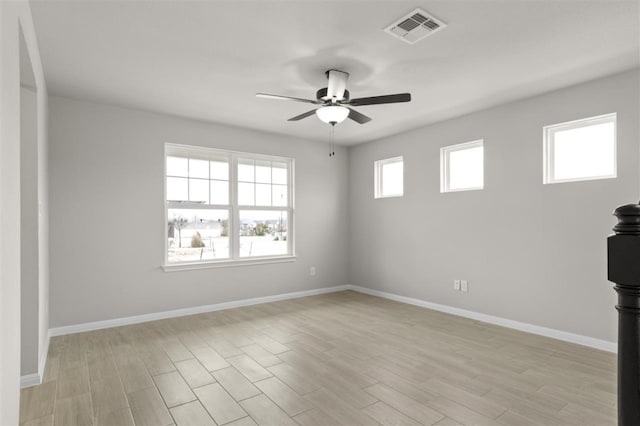 spare room with ceiling fan and light hardwood / wood-style floors