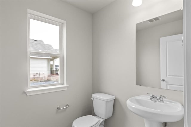 bathroom featuring toilet and sink