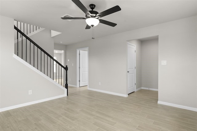 unfurnished living room with light wood-type flooring and ceiling fan