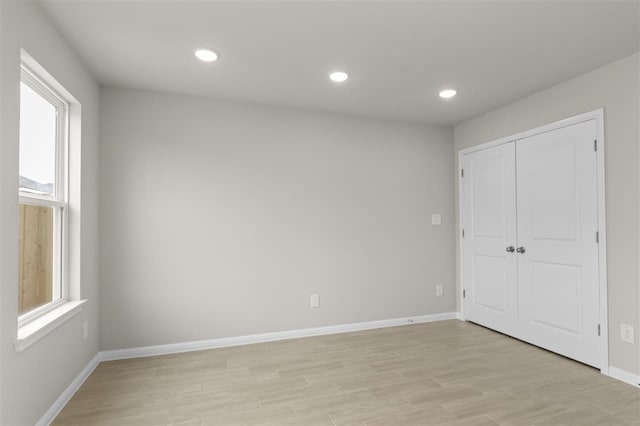 unfurnished bedroom featuring light wood-type flooring