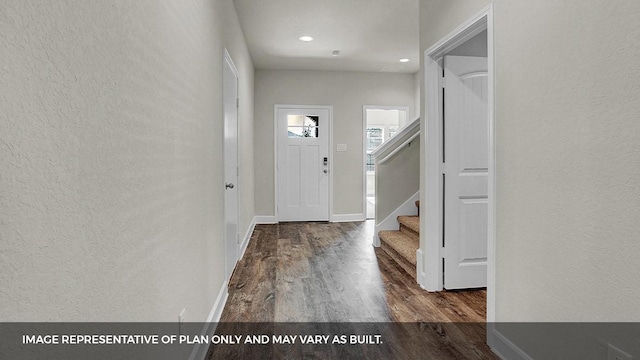 212 Heatherwood Ter, Marble Falls, TX 78654 - foyer entrance with wood finished floors, stairs, a textured wall, baseboards, and recessed lighting