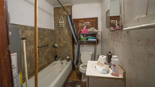 bathroom featuring tiled shower / bath, gas water heater, and toilet