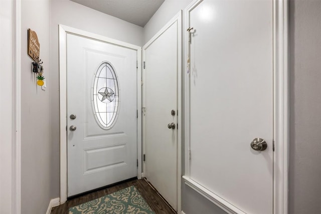 doorway to outside with dark hardwood / wood-style floors