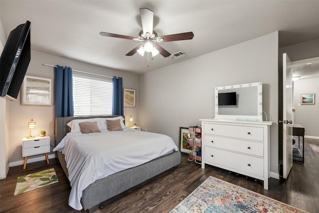 bedroom with ceiling fan and dark hardwood / wood-style flooring