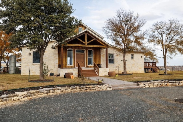 1440 W Klein Rd, New Braunfels, TX 78130 - view of front of property featuring stone siding, a front lawn, and a porch