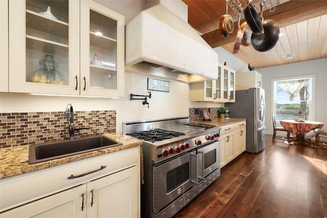 kitchen featuring sink, exhaust hood, light stone counters, wood ceiling, and appliances with stainless steel finishes