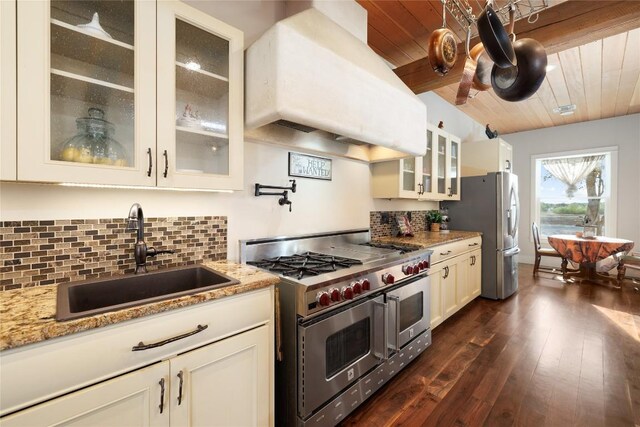 1440 W Klein Rd, New Braunfels, TX 78130 - kitchen featuring appliances with stainless steel finishes, premium range hood, decorative backsplash, dark wood-style flooring, and wooden ceiling