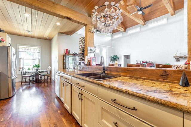 1440 W Klein Rd, New Braunfels, TX 78130 - kitchen with stainless steel fridge, a wooden ceiling with exposed beams, light stone countertops, dark wood-type flooring, and recessed lighting