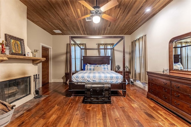 1440 W Klein Rd, New Braunfels, TX 78130 - bedroom featuring a fireplace with flush hearth, wood finished floors, and wooden ceiling
