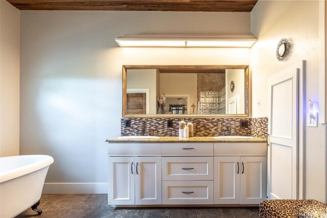 1440 W Klein Rd, New Braunfels, TX 78130 - bathroom with double vanity, tasteful backsplash, and a freestanding tub