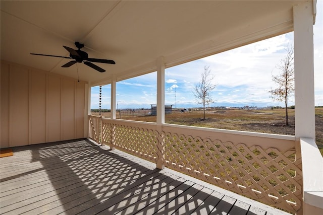 wooden deck featuring ceiling fan