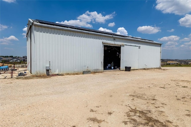 exterior space featuring an outbuilding