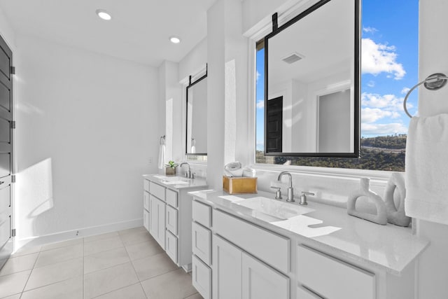 bathroom with vanity and tile patterned flooring