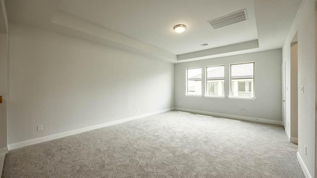 1024 Lariat Loop, Liberty Hill, TX 78642 - carpeted spare room featuring a raised ceiling and baseboards