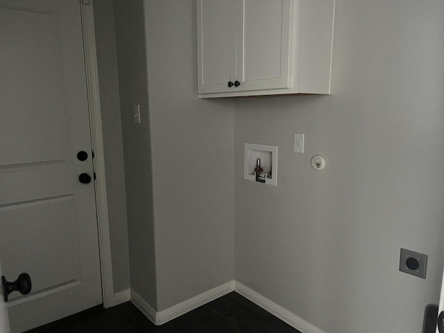 clothes washing area featuring cabinets, hookup for a washing machine, gas dryer hookup, and electric dryer hookup