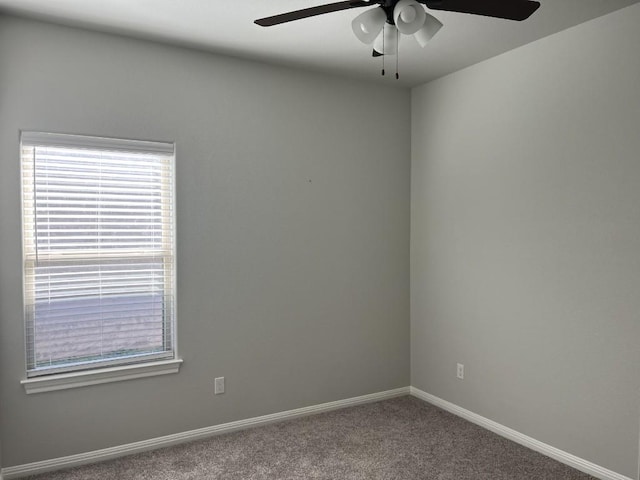 spare room featuring carpet flooring and ceiling fan