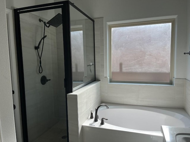 bathroom featuring vanity and separate shower and tub