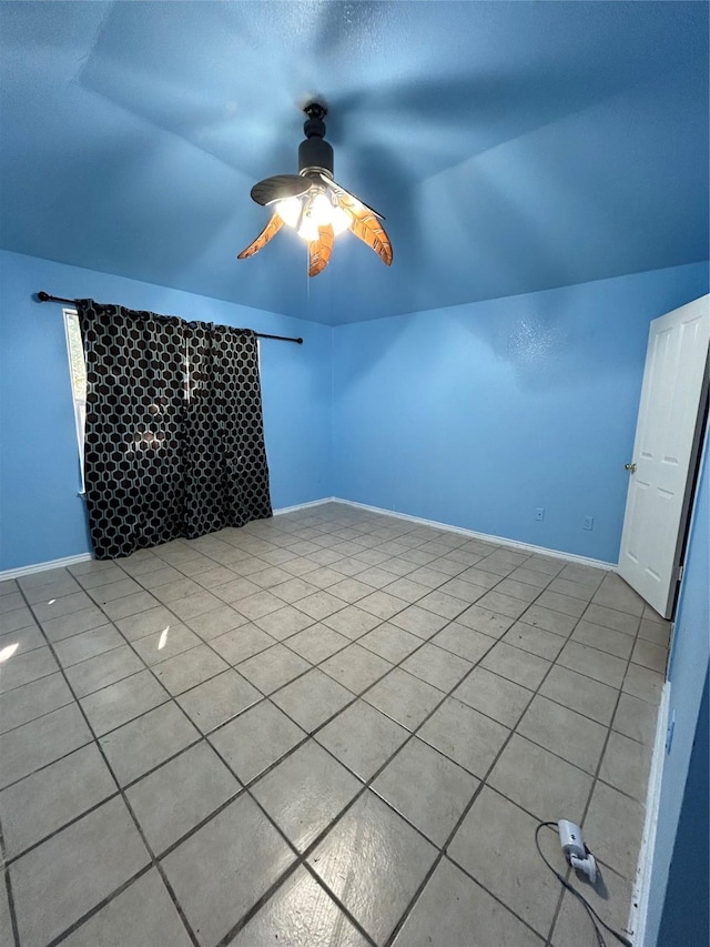 additional living space with light tile patterned floors, vaulted ceiling, and ceiling fan