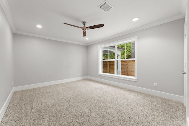 carpeted spare room featuring ceiling fan and ornamental molding