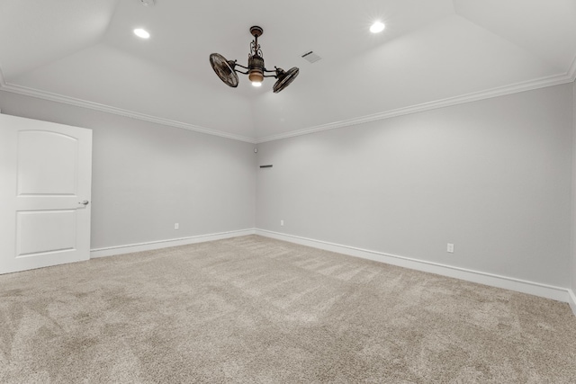 carpeted spare room with ceiling fan and crown molding