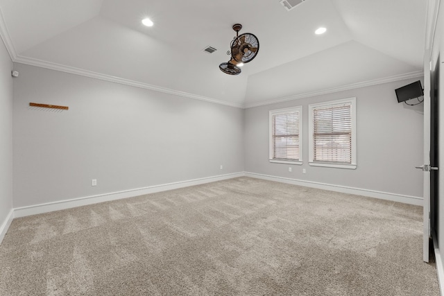 carpeted empty room featuring a raised ceiling and ornamental molding