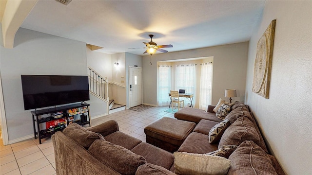 living room featuring ceiling fan and light tile patterned flooring