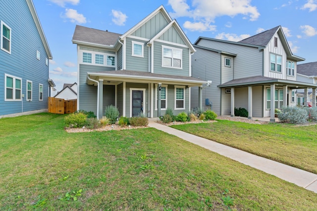 view of front of property with a porch and a front yard