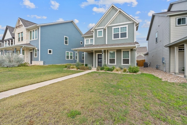 craftsman-style house featuring a front yard and central air condition unit