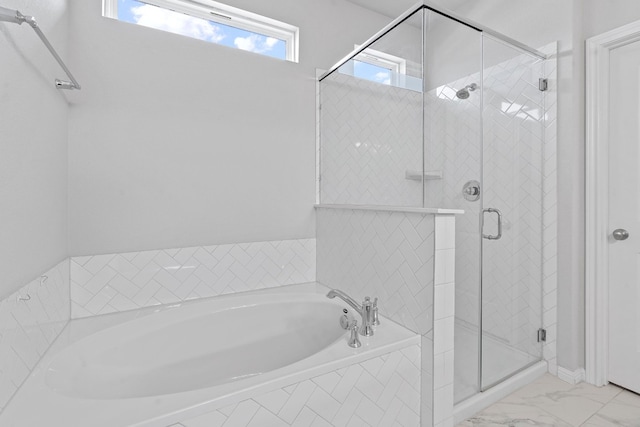 bathroom with shower with separate bathtub