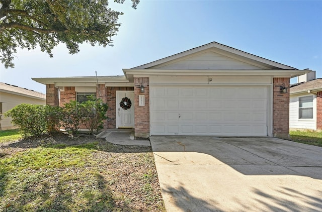 12825 Noche Clara Dr, Del Valle, TX 78617 - ranch-style house with a garage