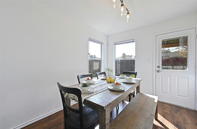 dining area featuring dark wood-type flooring