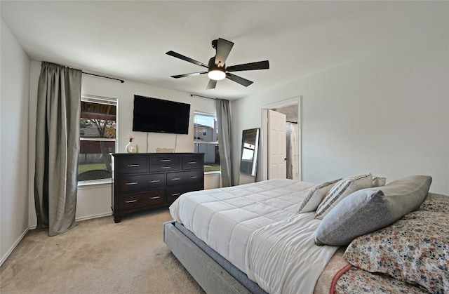 carpeted bedroom featuring ceiling fan