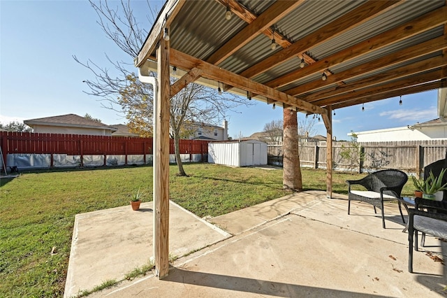 view of patio / terrace with a shed