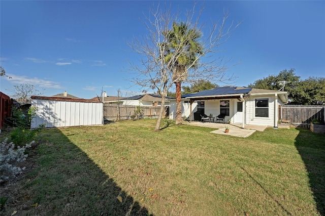 view of yard featuring a storage shed and a patio area