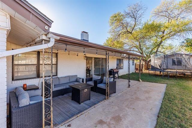 view of patio / terrace with outdoor lounge area, a grill, and a trampoline