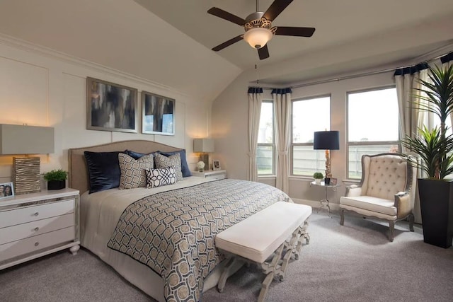 bedroom with carpet floors, vaulted ceiling, and ceiling fan