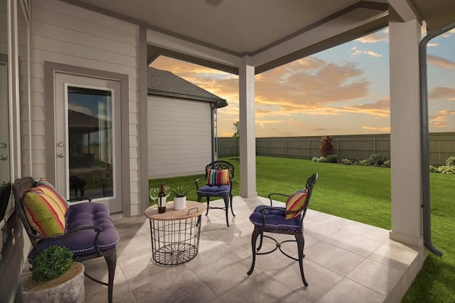 patio terrace at dusk with a yard