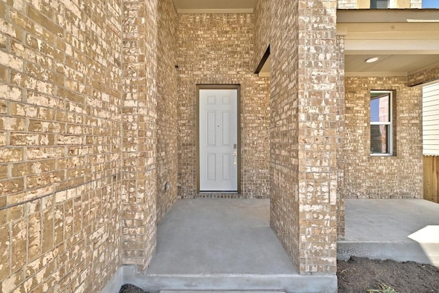 8004 Tranquil Glade Trl, Austin, TX 78744 - view of exterior entry featuring brick siding