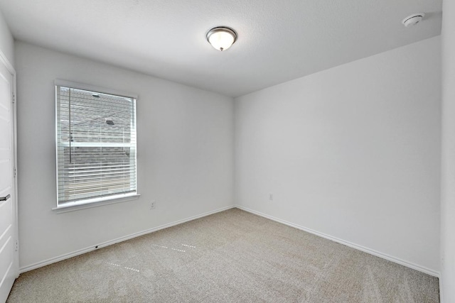 8004 Tranquil Glade Trl, Austin, TX 78744 - unfurnished room featuring carpet floors, a smoke detector, plenty of natural light, and baseboards