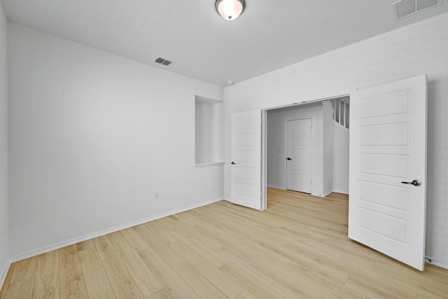 8004 Tranquil Glade Trl, Austin, TX 78744 - unfurnished bedroom featuring light wood-style flooring and baseboards