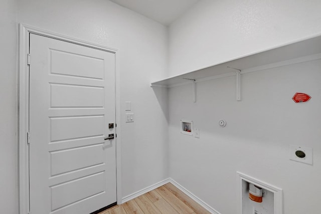 8004 Tranquil Glade Trl, Austin, TX 78744 - washroom featuring light wood-style floors, hookup for a washing machine, electric dryer hookup, gas dryer hookup, and baseboards