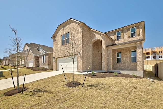 traditional-style house featuring brick siding, concrete driveway, an attached garage, and fence