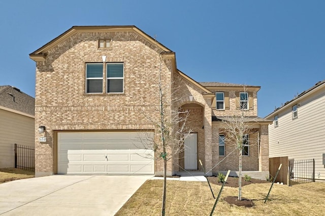 view of front facade featuring an attached garage, fence, and brick siding